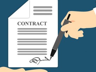 image of two hands signing a contract